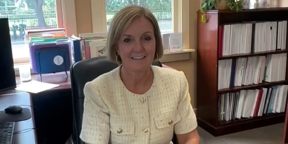 Becky Elliott, CEO of Frameworks of Tampa Bay, sits at her desk, sharing her excitement for the 2026-27 school year